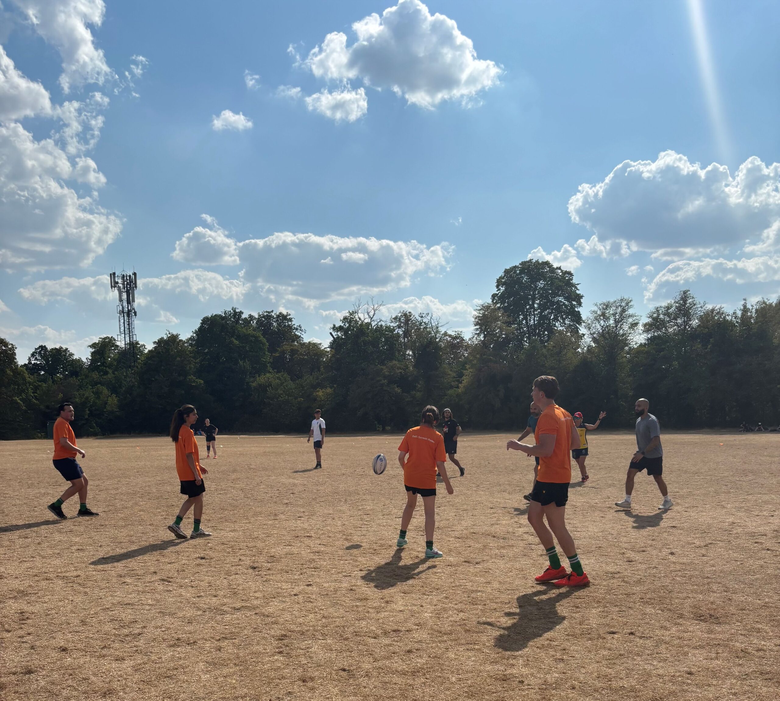 Team playing rugby outside